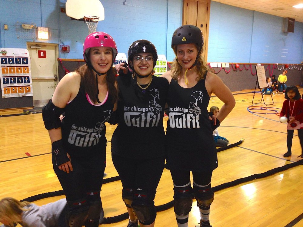 L. On Wheels, Fox Force and Scarlett Bruiser volunteer in Evanston.