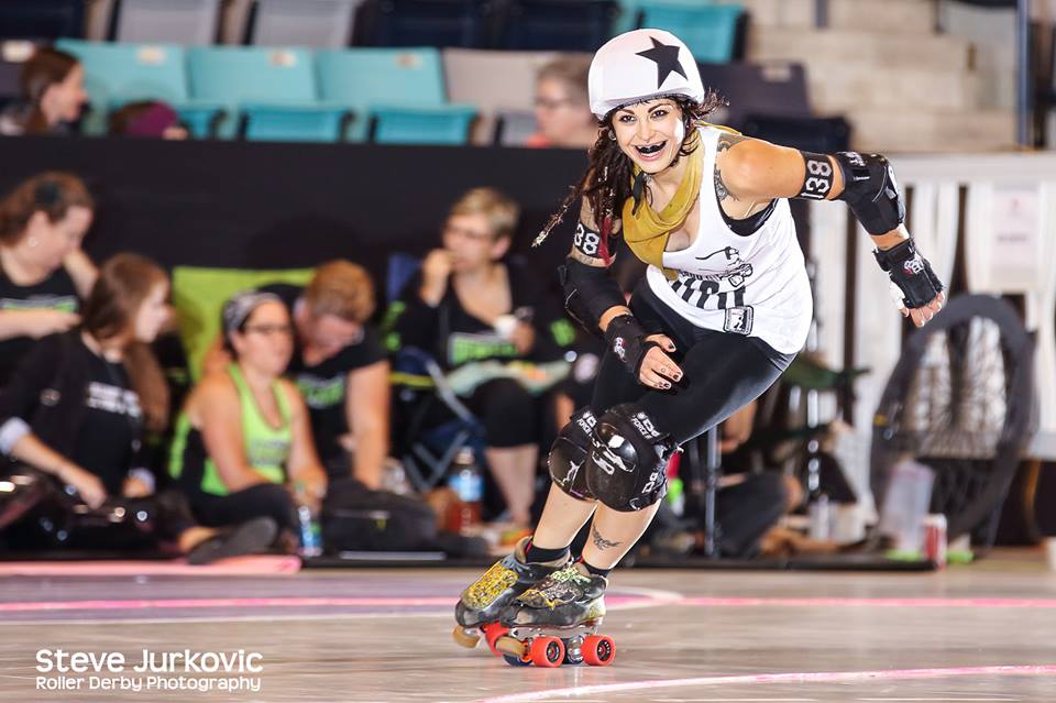 A smiling Lola Blow laps another pack